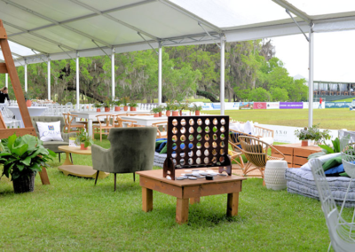 Connect Four game on Harvest side table at an outdoor backyard concept event in Ocala, Florida.