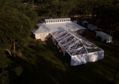 Aerial view of a clear top tent for an outdoor wedding reception in Ocala, Florida.