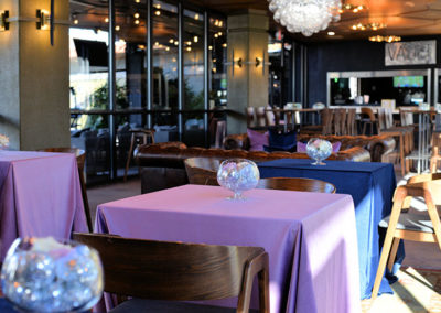 Purple and blue table cloths and Bias bowl disco centerpiece for an outdoor wedding reception in Ocala, Florida.