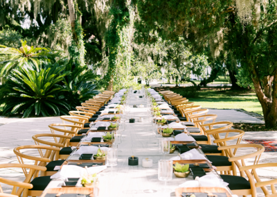 Wishbone chairs and Edison table at an outdoor rehearsal dinner in Jekyll Island, Georgia.