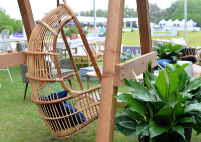 Swing chair with pillows at an outdoor event in Ocala, Florida.