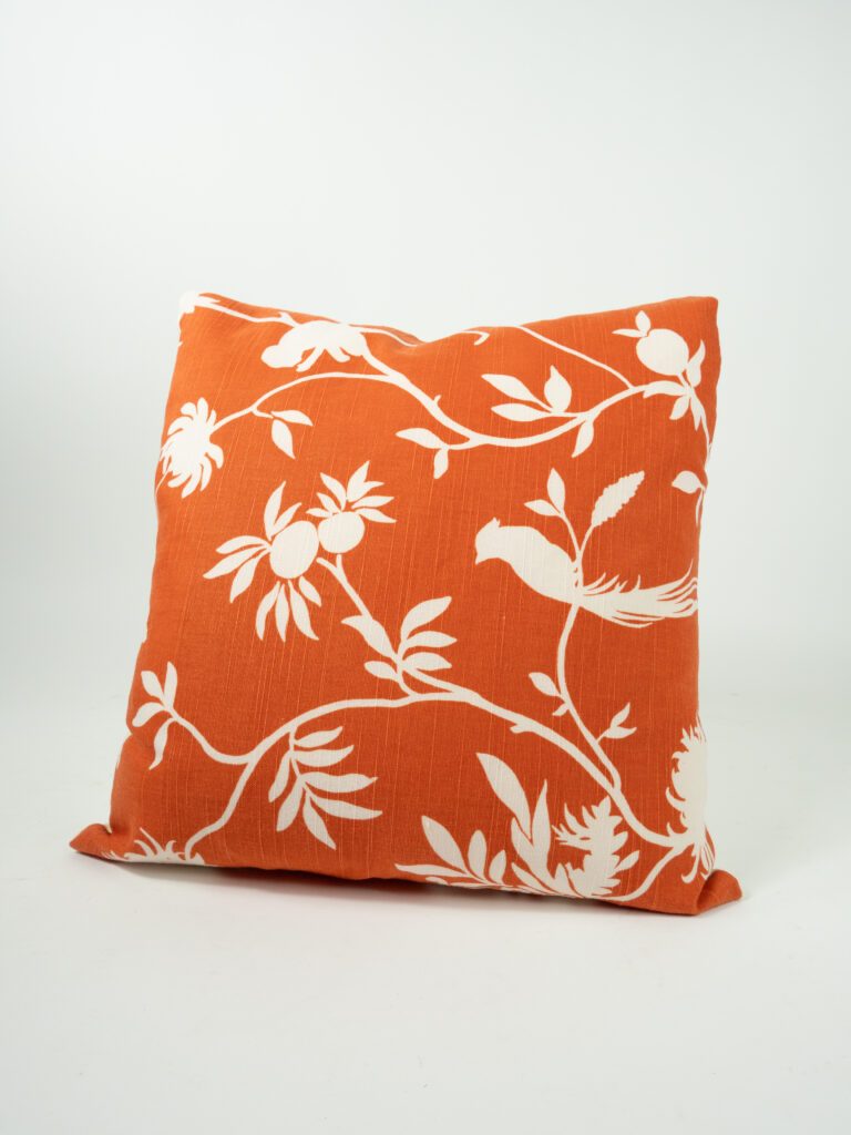 ORANGE PILLOW W/ IVORY BOTANICAL