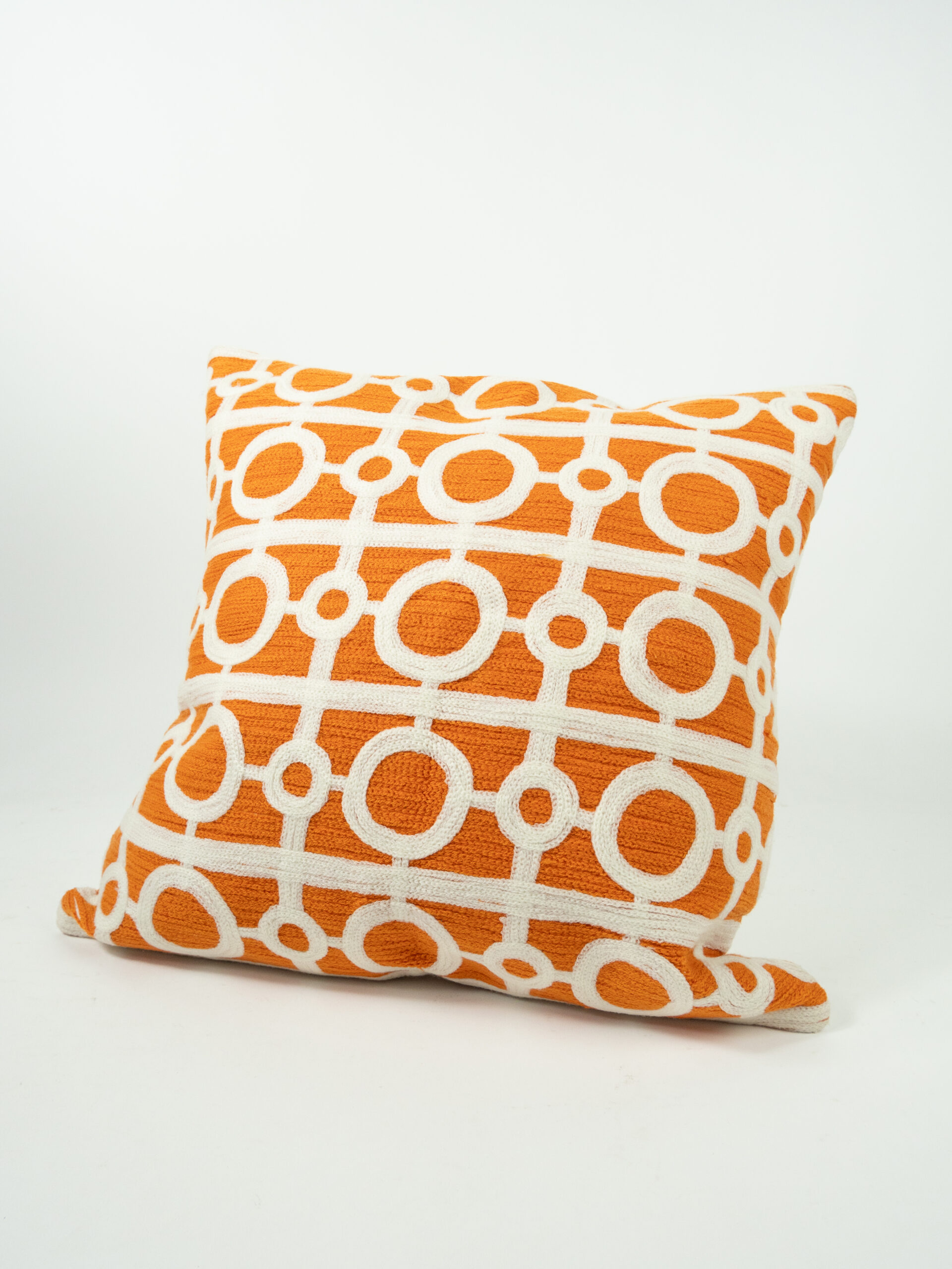 ORANGE PILLOW W/ WHITE CIRCLES