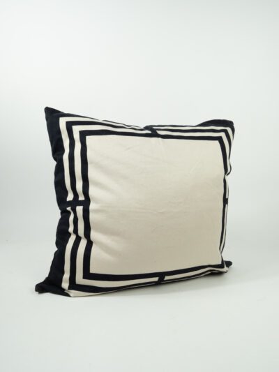 TAN PILLOW W/ BLACK BORDERS